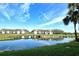 Scenic view of a waterfront condo with a bridge reflected in the serene water in a beautiful golf community at 5220 Hyland Hills Ave # 1211, Sarasota, FL 34241