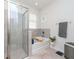 Relaxing bathroom with walk-in shower, separate tub, and elegant finishes at 5277 Grove Mill Loop, Bradenton, FL 34211