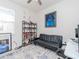 Comfortable bonus room with sofa, desk, and decorative art at 5277 Grove Mill Loop, Bradenton, FL 34211