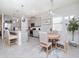 Open concept kitchen and dining area with modern finishes and natural light at 5277 Grove Mill Loop, Bradenton, FL 34211