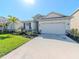 Beautiful single-Gathering home featuring stone accents, a well-manicured lawn and a two-car garage at 5277 Grove Mill Loop, Bradenton, FL 34211