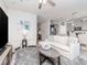 Comfortable living room with stylish decor, neutral tones, and an open view of the kitchen at 5277 Grove Mill Loop, Bradenton, FL 34211