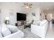 Cozy living room featuring comfortable seating, a large television, and stylish decor at 5277 Grove Mill Loop, Bradenton, FL 34211