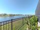 A tranquil pond view offering stunning views of the community homes and manicured lawns at 5277 Grove Mill Loop, Bradenton, FL 34211
