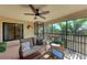Relaxing screened-in balcony with comfortable seating and serene outdoor view at 5577 Palmer Cir # 203, Bradenton, FL 34211