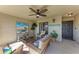 Screened-in lanai with comfortable seating, ceiling fan, and a relaxing atmosphere at 5577 Palmer Cir # 203, Bradenton, FL 34211