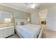 Bright, spacious main bedroom features a ceiling fan and elegant, neutral decor at 5577 Palmer Cir # 203, Bradenton, FL 34211