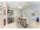 Stylish dining area with a rustic table, comfortable stools, and decorative shelving, creating a cozy atmosphere at 5577 Palmer Cir # 203, Bradenton, FL 34211