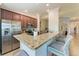 Well-appointed kitchen with granite counters, stainless appliances and bar stool seating at 5577 Palmer Cir # 203, Bradenton, FL 34211