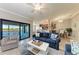 Inviting living room features an open layout, a view of the lake, and stylish furniture for a relaxing ambiance at 5577 Palmer Cir # 203, Bradenton, FL 34211