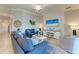 Cozy living room featuring stylish furniture, TV, and elegant decor at 5577 Palmer Cir # 203, Bradenton, FL 34211