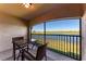 Relaxing screened patio area offering serene water views, complete with comfortable seating for outdoor enjoyment at 5577 Palmer Cir # 203, Bradenton, FL 34211