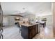 Spacious living room showcases an open layout, vaulted ceiling, and seamless flow to the kitchen and dining area at 5757 Jonesboro Ave, North Port, FL 34288