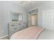 Bedroom featuring a dresser and neutral tones at 5931 Wake Forest Run # 104, Bradenton, FL 34211