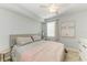 Bedroom featuring neutral décor and a ceiling fan at 5931 Wake Forest Run # 104, Bradenton, FL 34211