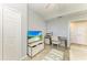 Bedroom featuring a television, work desk, and a closet at 5931 Wake Forest Run # 104, Bradenton, FL 34211