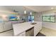 Modern kitchen with a large island, stainless steel appliances, and open to the living area for easy entertaining at 5931 Wake Forest Run # 104, Bradenton, FL 34211