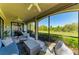 Relaxing screened lanai with comfortable seating, ideal for enjoying the beautiful outdoor view at 5931 Wake Forest Run # 104, Bradenton, FL 34211
