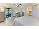 Relaxing main bedroom with a ceiling fan, neutral colors, and access to a private balcony at 5931 Wake Forest Run # 104, Bradenton, FL 34211