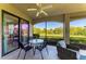 An outdoor patio features seating and views of lush landscaping at 5931 Wake Forest Run # 104, Bradenton, FL 34211