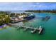Beautiful waterfront restaurant and marina with boat docks and scenic ocean views from an aerial perspective at 640 Fox St, Longboat Key, FL 34228