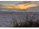 Picturesque beach view with a stunning sunset and scenic dune grass at 640 Fox St, Longboat Key, FL 34228