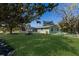 Charming single-story home with a well-manicured lawn and mature trees providing ample shade at 640 Fox St, Longboat Key, FL 34228