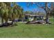 Charming single-story home with lush lawn, mature trees, and a tranquil setting at 640 Fox St, Longboat Key, FL 34228