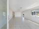 Bright and spacious living room with neutral tile flooring and lots of natural light at 640 Fox St, Longboat Key, FL 34228