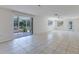 Expansive living room featuring tile flooring, patio doors, and natural light at 640 Fox St, Longboat Key, FL 34228