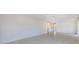 Open-concept living room featuring tile flooring and a view to kitchen at 640 Fox St, Longboat Key, FL 34228