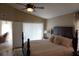 Comfortable bedroom with a queen bed, ceiling fan, and access to a sunroom at 6709 Rock Bridge Ln, Ellenton, FL 34222