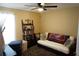 Bright bedroom featuring a full size bed and a decorative futon at 6709 Rock Bridge Ln, Ellenton, FL 34222