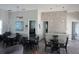 A community room with comfortable seating areas, tables, a TV, and plenty of natural light at 6709 Rock Bridge Ln, Ellenton, FL 34222