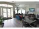 A community room with comfortable seating areas, tables, a TV, and plenty of natural light at 6709 Rock Bridge Ln, Ellenton, FL 34222