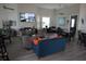 A community room with comfortable lounge chairs and tables, a TV, and plenty of seating for residents at 6709 Rock Bridge Ln, Ellenton, FL 34222