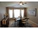 Cozy dining room with elegant decor and a large window at 6709 Rock Bridge Ln, Ellenton, FL 34222