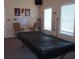 Game room with a pool table, seating, and natural light, great for entertaining at 6709 Rock Bridge Ln, Ellenton, FL 34222