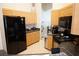 Efficient kitchen boasts stainless steel appliances, wood cabinets, and ample counter space at 6709 Rock Bridge Ln, Ellenton, FL 34222