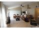 Spacious living room with comfortable leather furniture, neutral tones, and tile flooring at 6709 Rock Bridge Ln, Ellenton, FL 34222