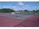 Community tennis court with well-maintained playing surface and net in good condition at 6709 Rock Bridge Ln, Ellenton, FL 34222