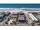 Breathtaking aerial view of beachfront condos with private beach access and manicured landscaping at 6804 Gulf Dr # 6804, Holmes Beach, FL 34217