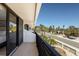 Balcony view overlooking lush greenery and a serene street at 6804 Gulf Dr # 6804, Holmes Beach, FL 34217