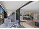 Relax on the spacious screened balcony, furnished with a seating area, with direct access to the living room at 6804 Gulf Dr # 6804, Holmes Beach, FL 34217