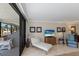 Relax on the spacious screened balcony, furnished with a seating area, with direct access to the living room at 6804 Gulf Dr # 6804, Holmes Beach, FL 34217