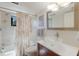 Bright bathroom with a glass bowl sink, neutral tile, and shower-tub combo at 6804 Gulf Dr # 6804, Holmes Beach, FL 34217