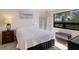 Comfortable bedroom with neutral colors and a bright window at 6804 Gulf Dr # 6804, Holmes Beach, FL 34217