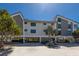 Unique exterior showing the elevated homes on a sandy lot with tropical landscaping at 6804 Gulf Dr # 6804, Holmes Beach, FL 34217