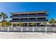 Exterior view of condo building, showing multiple stories, balconies, and parking underneath building at 6804 Gulf Dr # 6804, Holmes Beach, FL 34217
