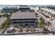 Three story condominium complex exterior with mature landscaping at 6804 Gulf Dr # 6804, Holmes Beach, FL 34217